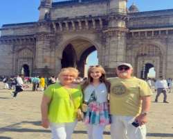 She shared a photograph of her alongside her grandparents in front of <a href=